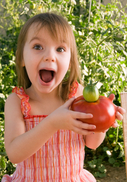 Girl with tomato for healthy life